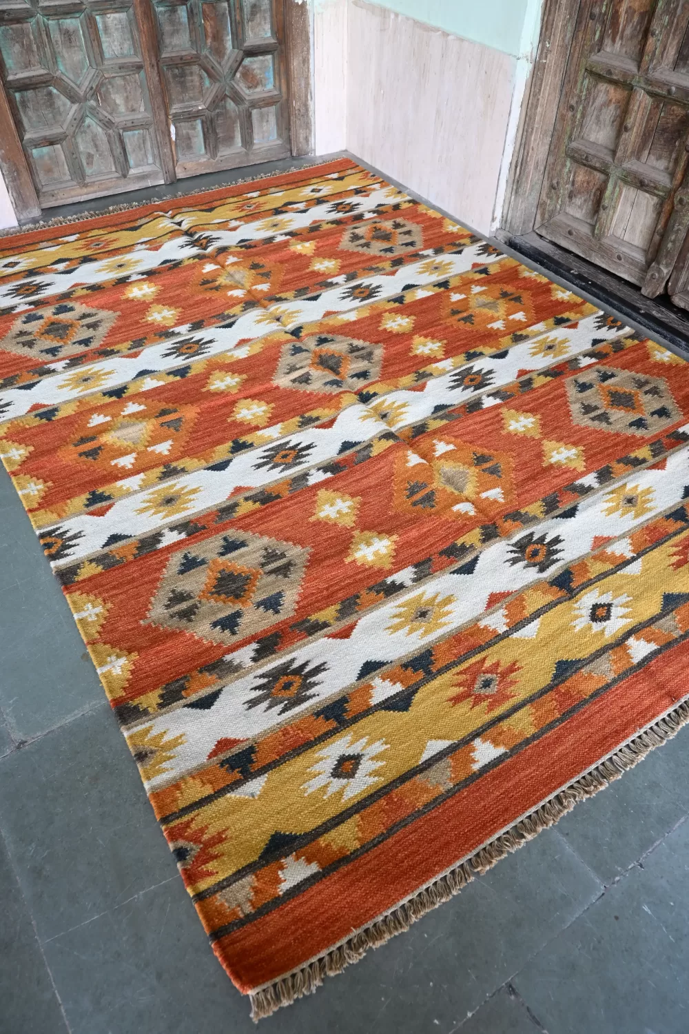 burnt orange wool dhurrie rug flatweave texture