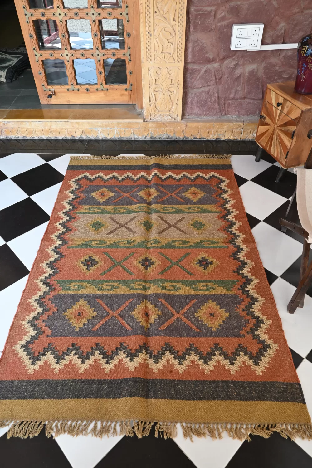 rust/burnt orange jute dhurrie rug flatweave texture